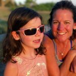 Image description: Annie Cohane with her mom Jenny. Annie was diagnosed with Leber congenital amaurosis (LCA) at 3 months of age. Genetic testing later showed a mutation in her CEP290 gene. 