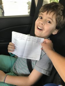 9-year-old Creed Pettit holding his "surgery scheduled" paperwork after he and his mom met with surgeons at Bascom Palmer Eye Institute in Miami to schedule his gene therapy treatment with LUXTURNA. The treatment will reverse Creed's vision loss due to Leber congenital amaurosis with a mutation of the RPE65 gene.