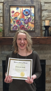 Smiling young woman with certificate