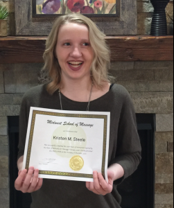 Smiling young woman with certificate