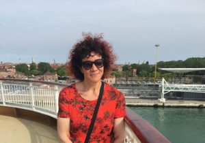 Damiana Harper standing on walkway by water.