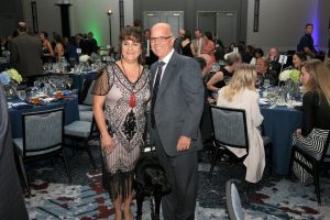 Man and woman posing at fancy party