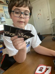 Young boy playing UNO