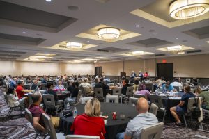Conference attendees listening to the “Participating in a Clinical Trial” panel session.