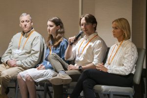 Jack speaking on podium to audience. 